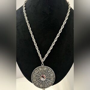 Zodiac Wheel Astrology Pendant Circa 1972
Marked NAPIER Silver Tone Neck…